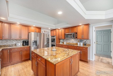 Welcome to this beautifully upgraded home nestled in the on The Broadlands Golf Course in Colorado - for sale on GolfHomes.com, golf home, golf lot