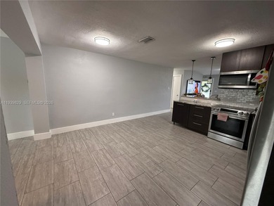 3/2 waterfront pool home in desirable Cooper City. Open-concept on Cooper Colony Country Club in Florida - for sale on GolfHomes.com, golf home, golf lot