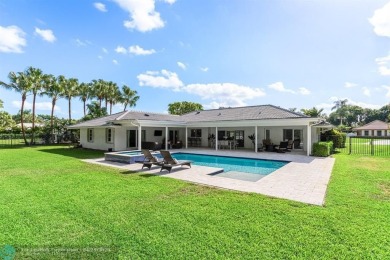 Welcome to 10871 Gleneagles Road, an inviting 4-bedroom on Pine Tree Golf Club in Florida - for sale on GolfHomes.com, golf home, golf lot