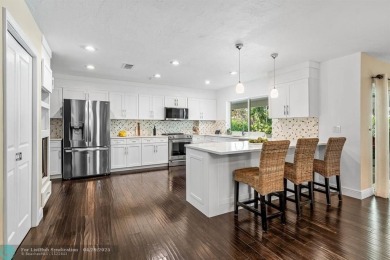 Welcome to 10871 Gleneagles Road, an inviting 4-bedroom on Pine Tree Golf Club in Florida - for sale on GolfHomes.com, golf home, golf lot