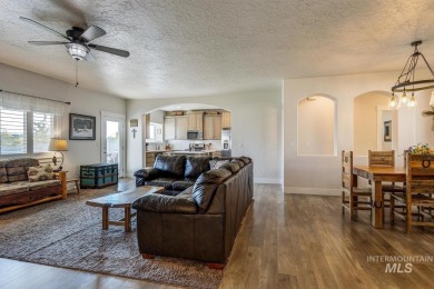 A meticulous home offering a seamless open-concept design with on Hunters Point Golf Club in Idaho - for sale on GolfHomes.com, golf home, golf lot