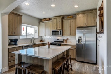 A meticulous home offering a seamless open-concept design with on Hunters Point Golf Club in Idaho - for sale on GolfHomes.com, golf home, golf lot
