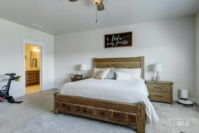 A meticulous home offering a seamless open-concept design with on Hunters Point Golf Club in Idaho - for sale on GolfHomes.com, golf home, golf lot