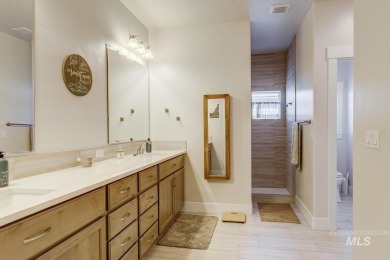 A meticulous home offering a seamless open-concept design with on Hunters Point Golf Club in Idaho - for sale on GolfHomes.com, golf home, golf lot