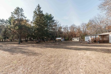 Welcome to this charming manufactured home, situated on over an on Sand Valley Golf Course in Wisconsin - for sale on GolfHomes.com, golf home, golf lot