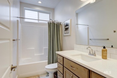 A meticulous home offering a seamless open-concept design with on Hunters Point Golf Club in Idaho - for sale on GolfHomes.com, golf home, golf lot