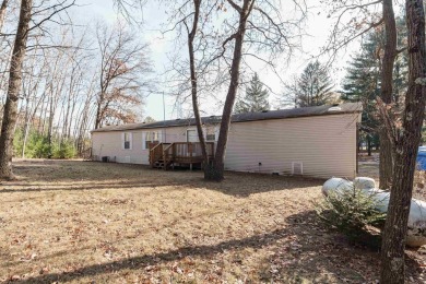 Welcome to this charming manufactured home, situated on over an on Sand Valley Golf Course in Wisconsin - for sale on GolfHomes.com, golf home, golf lot