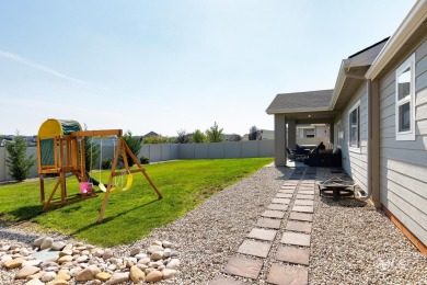 A meticulous home offering a seamless open-concept design with on Hunters Point Golf Club in Idaho - for sale on GolfHomes.com, golf home, golf lot
