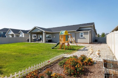 A meticulous home offering a seamless open-concept design with on Hunters Point Golf Club in Idaho - for sale on GolfHomes.com, golf home, golf lot
