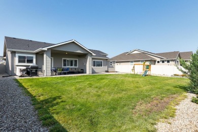 A meticulous home offering a seamless open-concept design with on Hunters Point Golf Club in Idaho - for sale on GolfHomes.com, golf home, golf lot