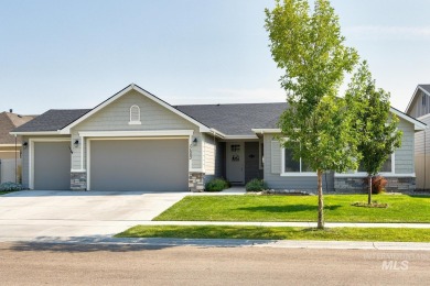 A meticulous home offering a seamless open-concept design with on Hunters Point Golf Club in Idaho - for sale on GolfHomes.com, golf home, golf lot