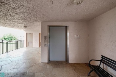 Top-floor 2BD/2BA condo in Sunrise Lakes Phase 4, a 55+ on Sunrise Lakes Phase IV Golf Course in Florida - for sale on GolfHomes.com, golf home, golf lot