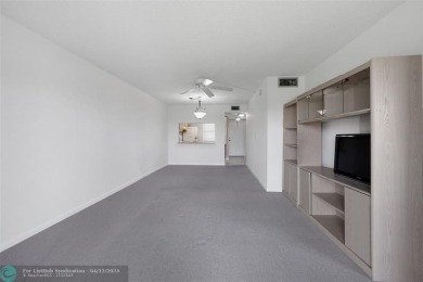 Top-floor 2BD/2BA condo in Sunrise Lakes Phase 4, a 55+ on Sunrise Lakes Phase IV Golf Course in Florida - for sale on GolfHomes.com, golf home, golf lot