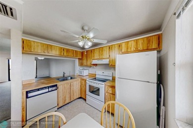 Top-floor 2BD/2BA condo in Sunrise Lakes Phase 4, a 55+ on Sunrise Lakes Phase IV Golf Course in Florida - for sale on GolfHomes.com, golf home, golf lot