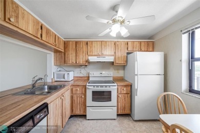 Top-floor 2BD/2BA condo in Sunrise Lakes Phase 4, a 55+ on Sunrise Lakes Phase IV Golf Course in Florida - for sale on GolfHomes.com, golf home, golf lot
