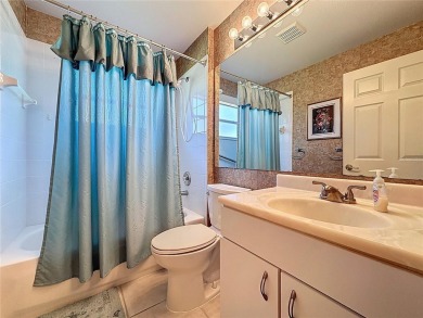 One of a kind expanded Canterbury model home on large golf on Kings Ridge Golf Club in Florida - for sale on GolfHomes.com, golf home, golf lot