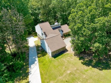 Upon entry, you're greeted by updated marble LVT flooring on Nob North Golf Course in Georgia - for sale on GolfHomes.com, golf home, golf lot