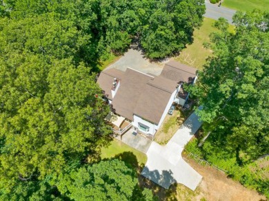 Upon entry, you're greeted by updated marble LVT flooring on Nob North Golf Course in Georgia - for sale on GolfHomes.com, golf home, golf lot