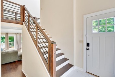 Upon entry, you're greeted by updated marble LVT flooring on Nob North Golf Course in Georgia - for sale on GolfHomes.com, golf home, golf lot