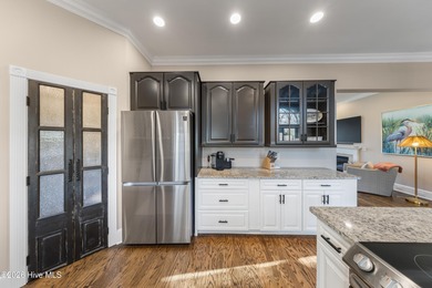 Prepare to be wowed! A must see in person, this custom brick on Members Club At St. James Plantation in North Carolina - for sale on GolfHomes.com, golf home, golf lot