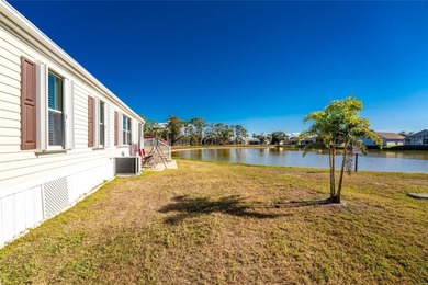 Beautifully Finished Waterfront Home featuring 2 bedrooms and 2 on Kings Gate Golf Club in Florida - for sale on GolfHomes.com, golf home, golf lot