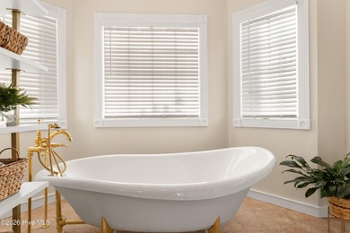 Prepare to be wowed! A must see in person, this custom brick on Members Club At St. James Plantation in North Carolina - for sale on GolfHomes.com, golf home, golf lot