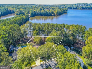 LAKEFRONT LIVING with over 180' of Lake Kedron views and on Canongate At Flat Creek Club in Georgia - for sale on GolfHomes.com, golf home, golf lot