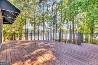 LAKEFRONT LIVING with over 180' of Lake Kedron views and on Canongate At Flat Creek Club in Georgia - for sale on GolfHomes.com, golf home, golf lot