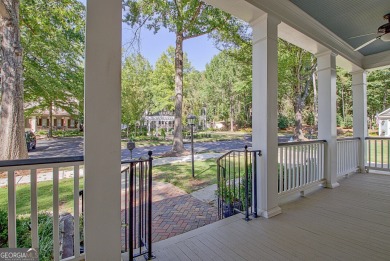 LAKEFRONT LIVING with over 180' of Lake Kedron views and on Canongate At Flat Creek Club in Georgia - for sale on GolfHomes.com, golf home, golf lot