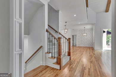 LAKEFRONT LIVING with over 180' of Lake Kedron views and on Canongate At Flat Creek Club in Georgia - for sale on GolfHomes.com, golf home, golf lot