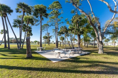 Beautifully Finished Waterfront Home featuring 2 bedrooms and 2 on Kings Gate Golf Club in Florida - for sale on GolfHomes.com, golf home, golf lot