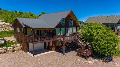 This charming cabin is nestled in a cul-de-sac with beautiful on Bear Lake West Golf and Country Club in Idaho - for sale on GolfHomes.com, golf home, golf lot