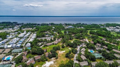 Located directly on the 16th  hole in the gated community of on Seascape Golf Course in Florida - for sale on GolfHomes.com, golf home, golf lot