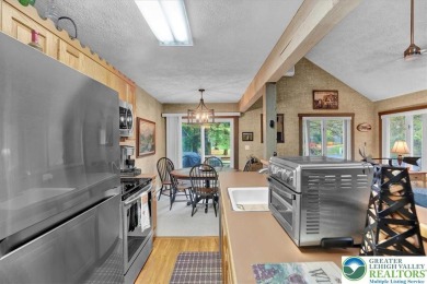 Turnkey Mountain Escape with Slope-Side Access - Snow Ridge on Jack Frost National Golf Course in Pennsylvania - for sale on GolfHomes.com, golf home, golf lot