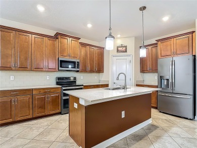 Spacious Multi-Generational Living with PRIVATE IN-LAW SUITE on Providence Golf Club in Florida - for sale on GolfHomes.com, golf home, golf lot