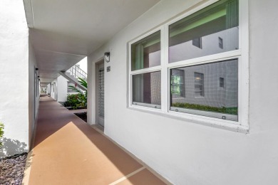 SOUGHT AFTER 1ST FLOOR 1BR/ 1.5 BA UNIT IN NORMANDY D W/ IMPACT on Kings Point Golf -Flanders Way in Florida - for sale on GolfHomes.com, golf home, golf lot
