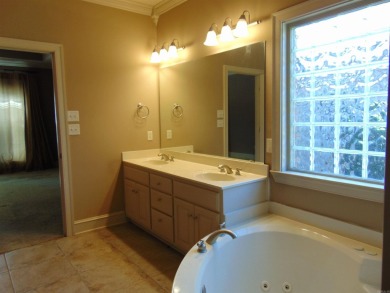 Spacious home that features 4 bedrooms & 2 1/2 baths, Tile in on The Country Club of Arkansas in Arkansas - for sale on GolfHomes.com, golf home, golf lot