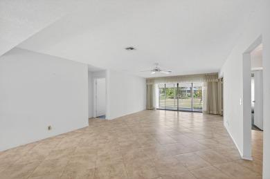 Nestled in the exclusive Quail Ridge Country Club, this 3-bed on Quail Ridge Golf Course and Country Club in Florida - for sale on GolfHomes.com, golf home, golf lot