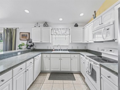 Welcome to this lovely Eagle model in Kingfisher Villas, located on The Links of Spruce Creek in Florida - for sale on GolfHomes.com, golf home, golf lot