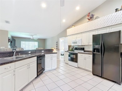 Lovely stucco turn-key 3 bedroom/2 bath, ASPEN style home in on Eagle Ridge At Spruce Creek Country Club in Florida - for sale on GolfHomes.com, golf home, golf lot