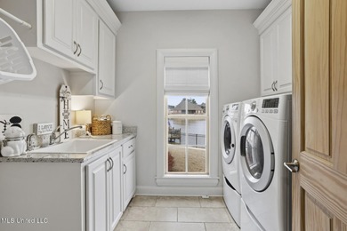 GORGEOUS PROPERTY MADE AVAILABLE DUE TO CORPORATE RELOCATION on Lake Caroline Golf Club in Mississippi - for sale on GolfHomes.com, golf home, golf lot