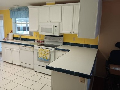 Tremendous 3-bedroom 2-bath located on the 9th fairway at Four on Four Lakes Golf Club in Florida - for sale on GolfHomes.com, golf home, golf lot