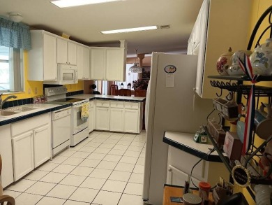 Tremendous 3-bedroom 2-bath located on the 9th fairway at Four on Four Lakes Golf Club in Florida - for sale on GolfHomes.com, golf home, golf lot
