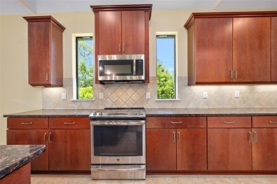This custom home built 2018 sits on over  3/4  of an acre, in on Plantation Bay Golf and Country Club in Florida - for sale on GolfHomes.com, golf home, golf lot