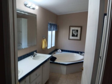Tremendous 3-bedroom 2-bath located on the 9th fairway at Four on Four Lakes Golf Club in Florida - for sale on GolfHomes.com, golf home, golf lot