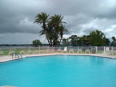 Tremendous 3-bedroom 2-bath located on the 9th fairway at Four on Four Lakes Golf Club in Florida - for sale on GolfHomes.com, golf home, golf lot