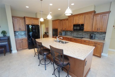 Welcome to this beautiful 2014, 4 bedroom, 3 bath home that has on Twin Isles Country Club in Florida - for sale on GolfHomes.com, golf home, golf lot