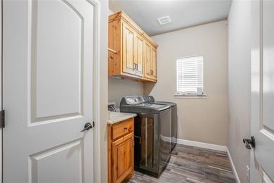 Situated high at the end of a quiet cul-de-sac, this brick and on Pecan Plantation Country Club in Texas - for sale on GolfHomes.com, golf home, golf lot