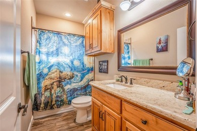 Situated high at the end of a quiet cul-de-sac, this brick and on Pecan Plantation Country Club in Texas - for sale on GolfHomes.com, golf home, golf lot