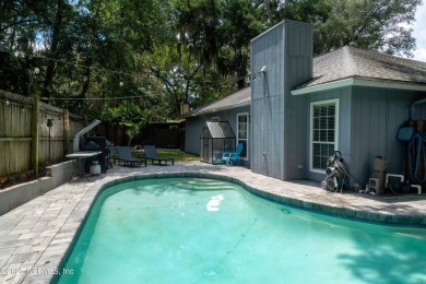 Fantastic pool home tucked away in a quiet Fort Caroline on Hidden Hills Country Club in Florida - for sale on GolfHomes.com, golf home, golf lot